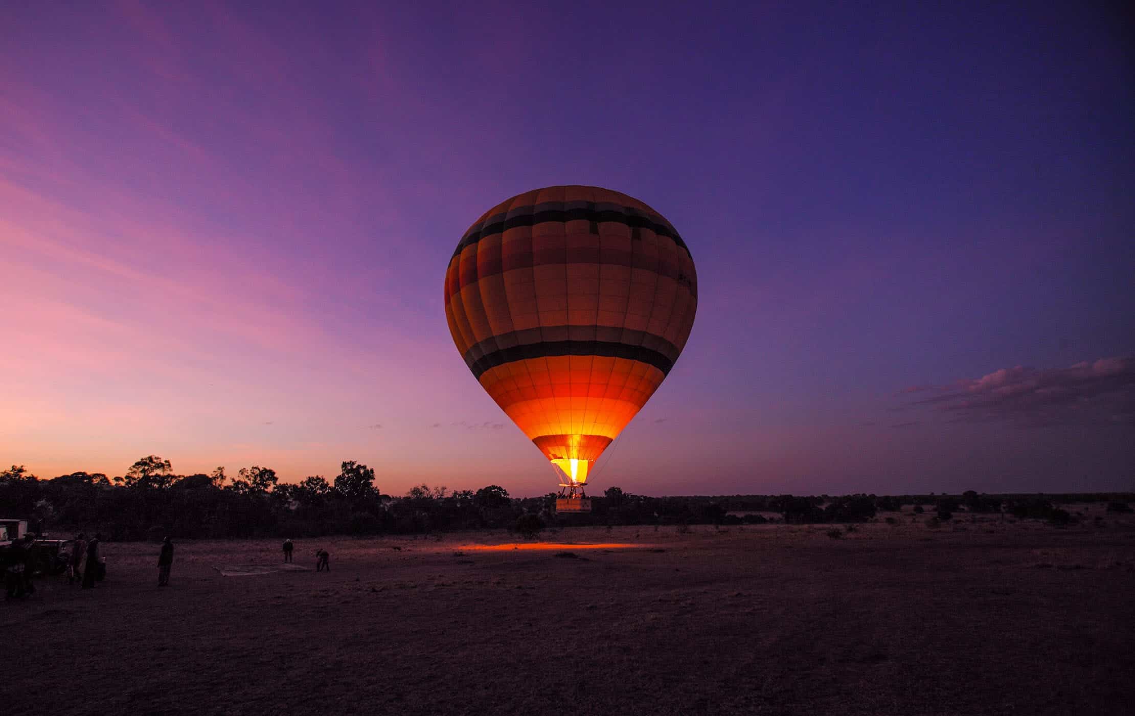 Hot air balloons floating over Africa