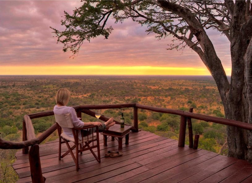 Enjoying champagne while watching sunset at Meru National Park, Kenya