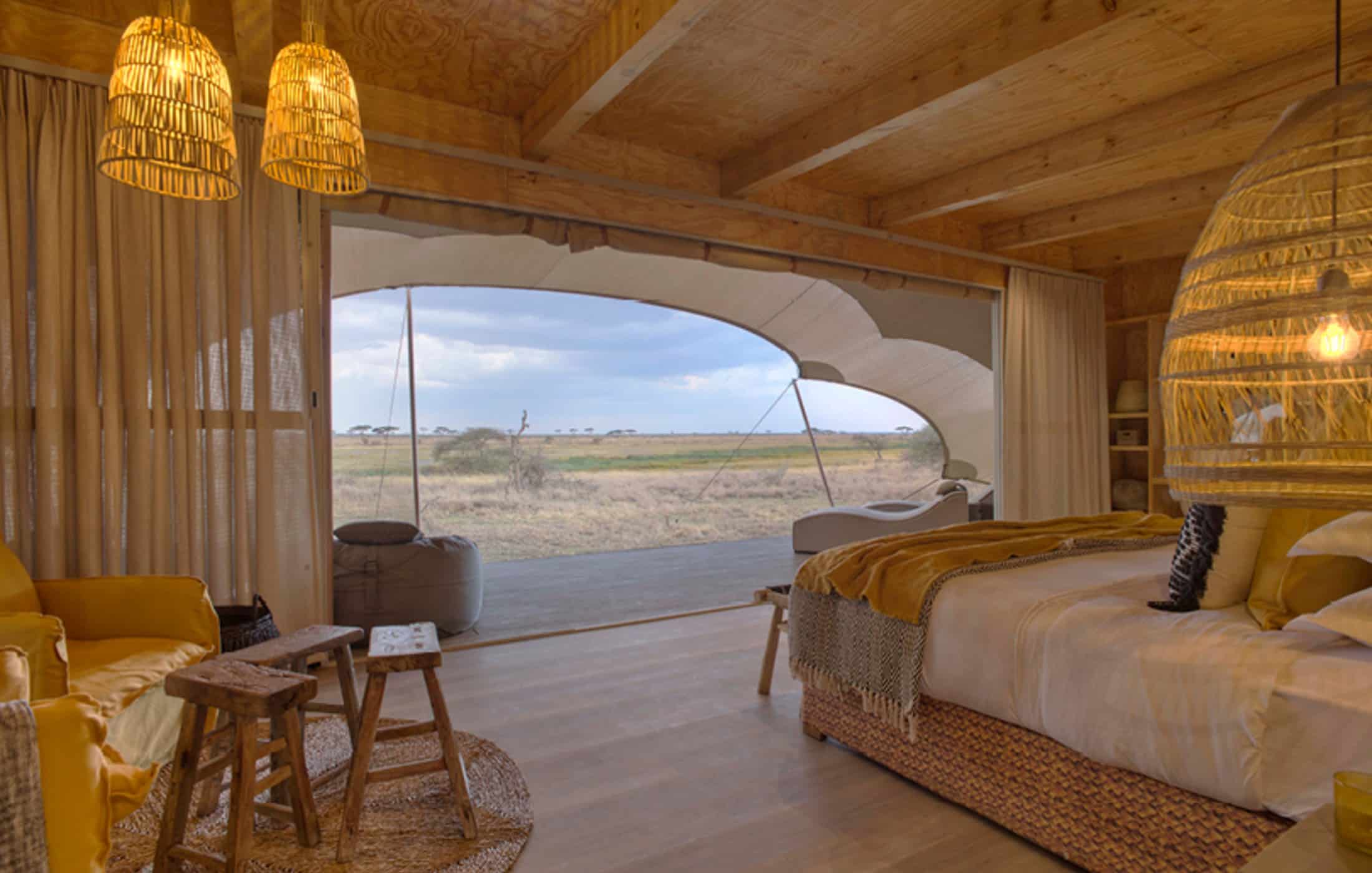 A bedroom looking out into the safari
