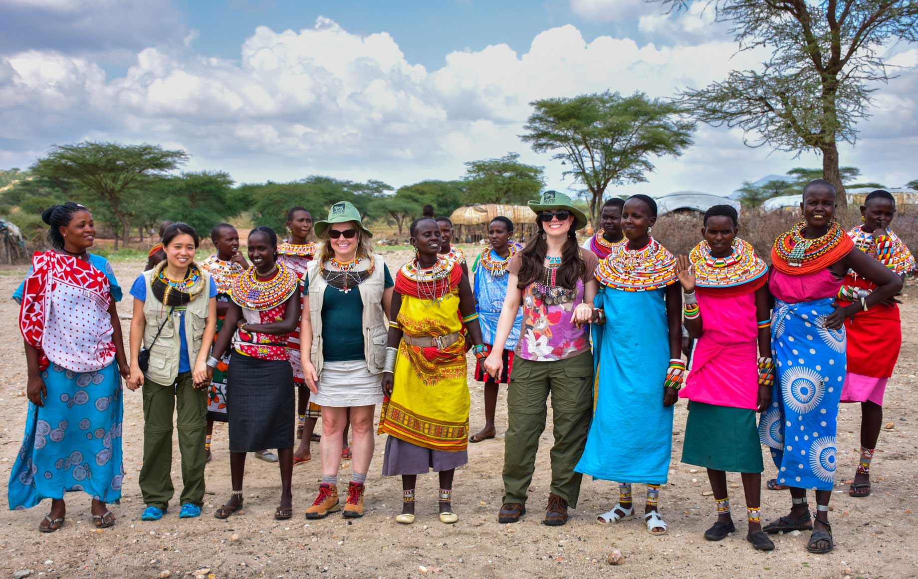 Smiling tourists and tribe ladies at Samburu National Reserve