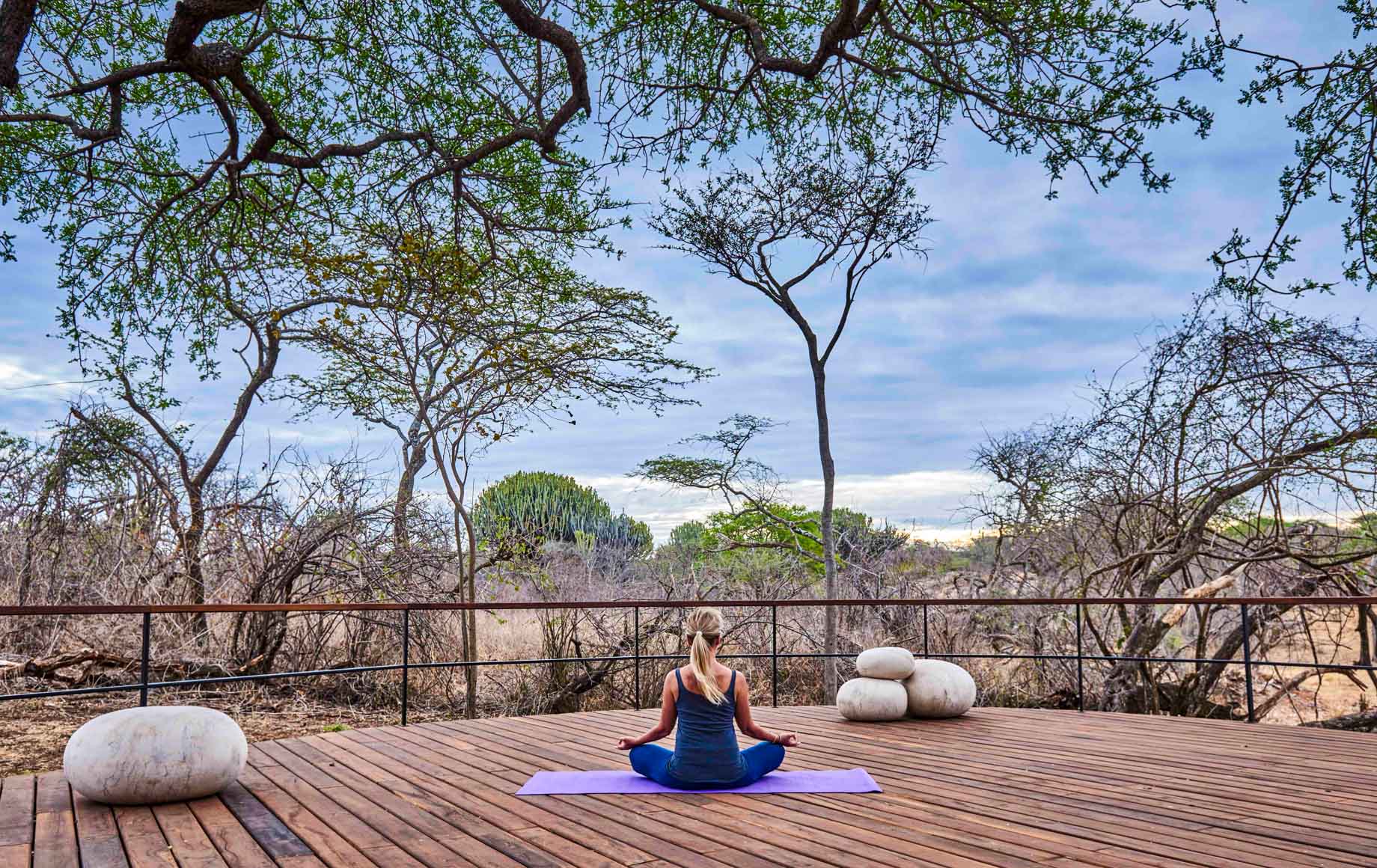 Yoga on lodge decks, Serengeti safari, Tanzania