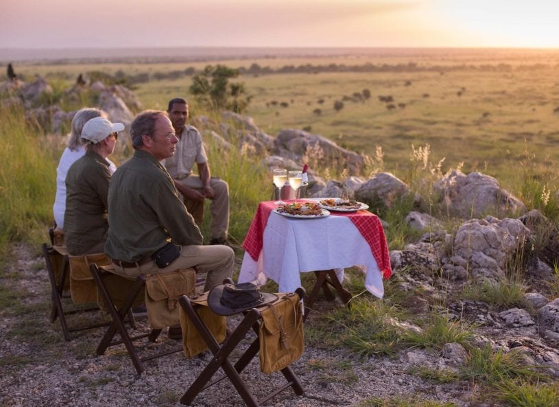 Family picnic dinner in nature at Tarangire African Safari