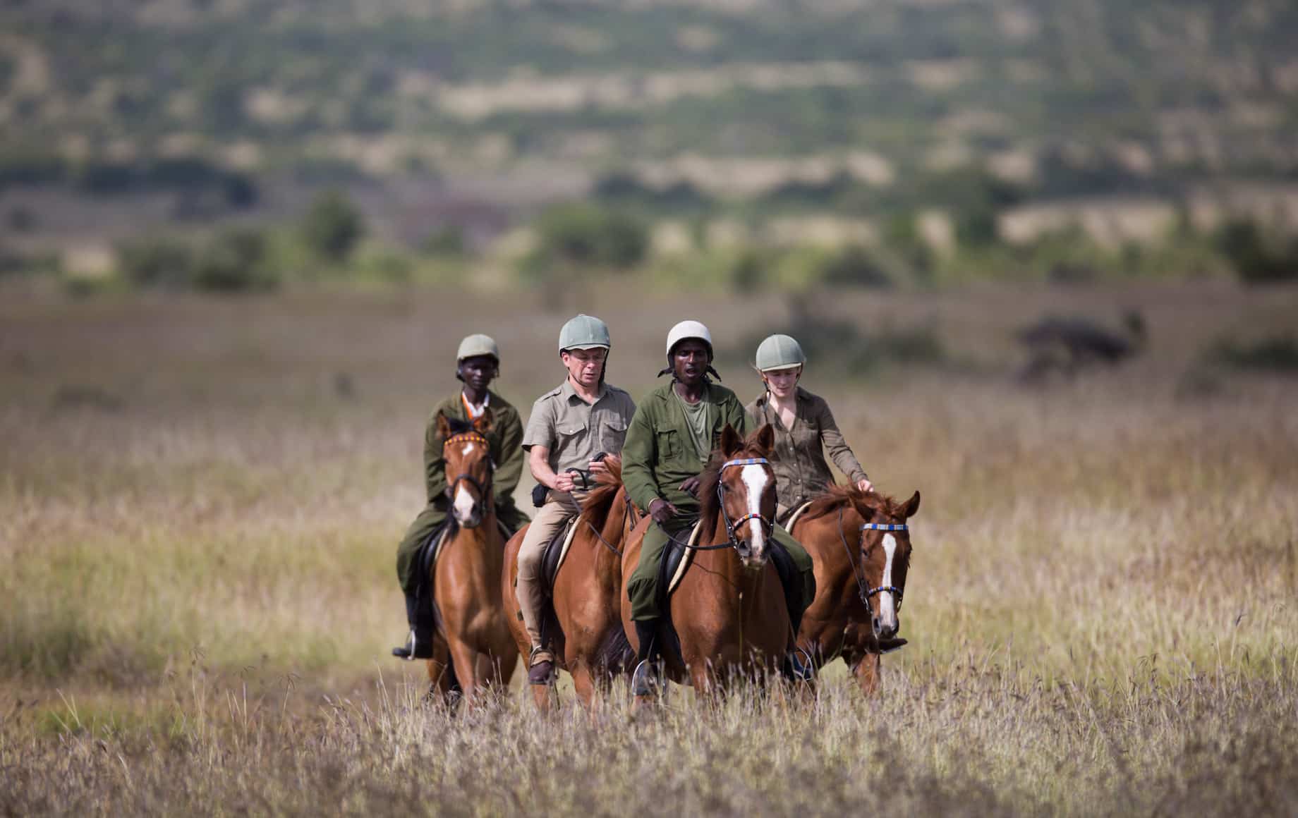 Safari guides on horseback at Loisaba Conservancy