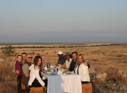 Friends eating dinner in the desert