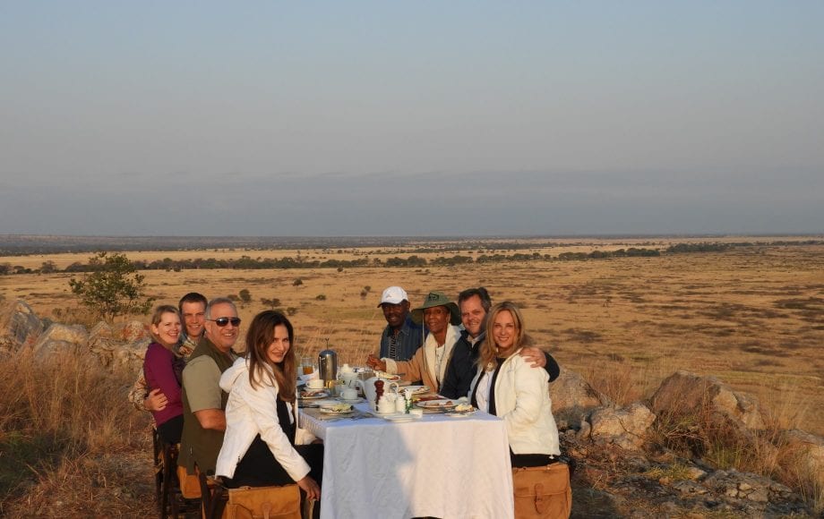 Friends eating dinner in the desert