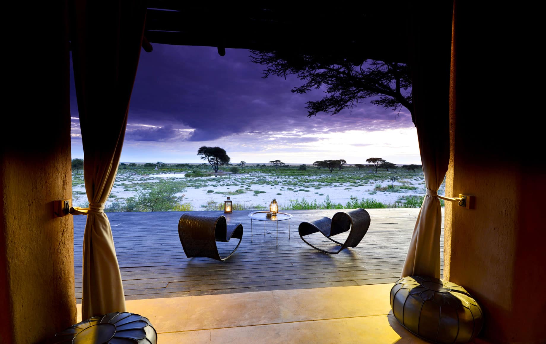 Chairs overlook Africa plains in evening