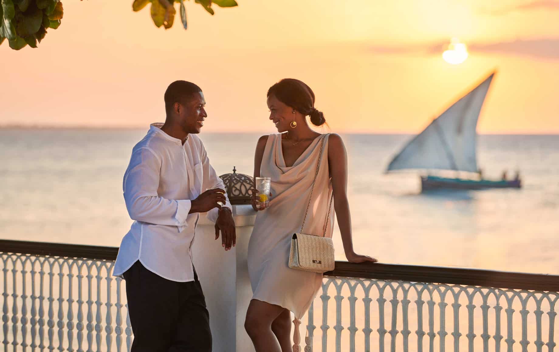 Couple on deck at sunset at Park Hyatt, Zanzibar