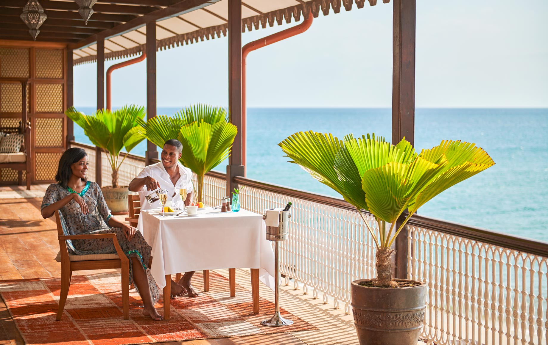 Couple dines outside at Park Hyatt, Zanzibar