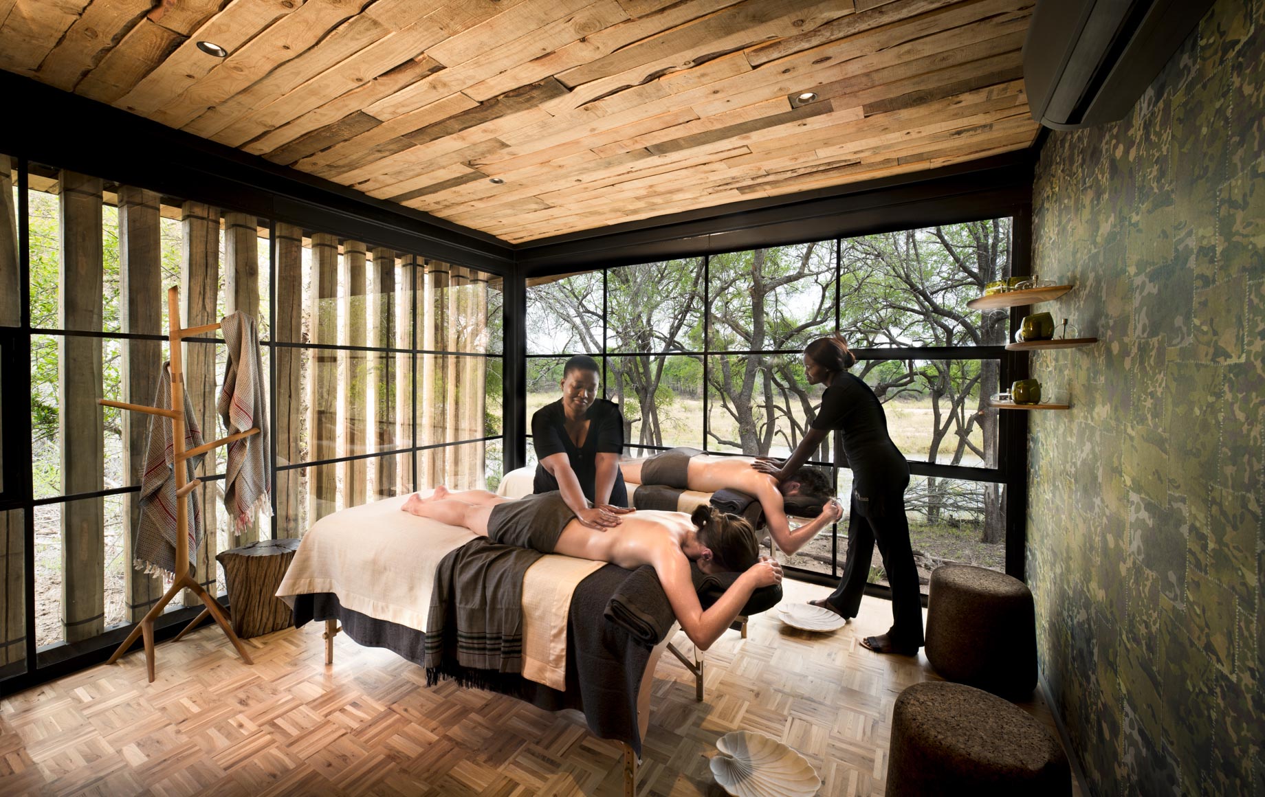 Two travelers get massages at Tengile River Lodge