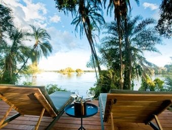 Chairs on deck overlooking river