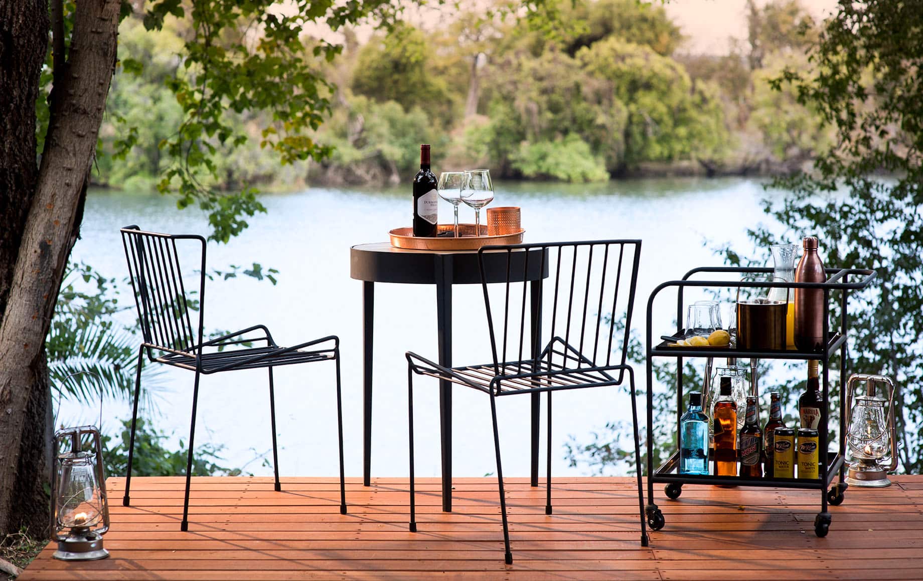 Small table on deck near river