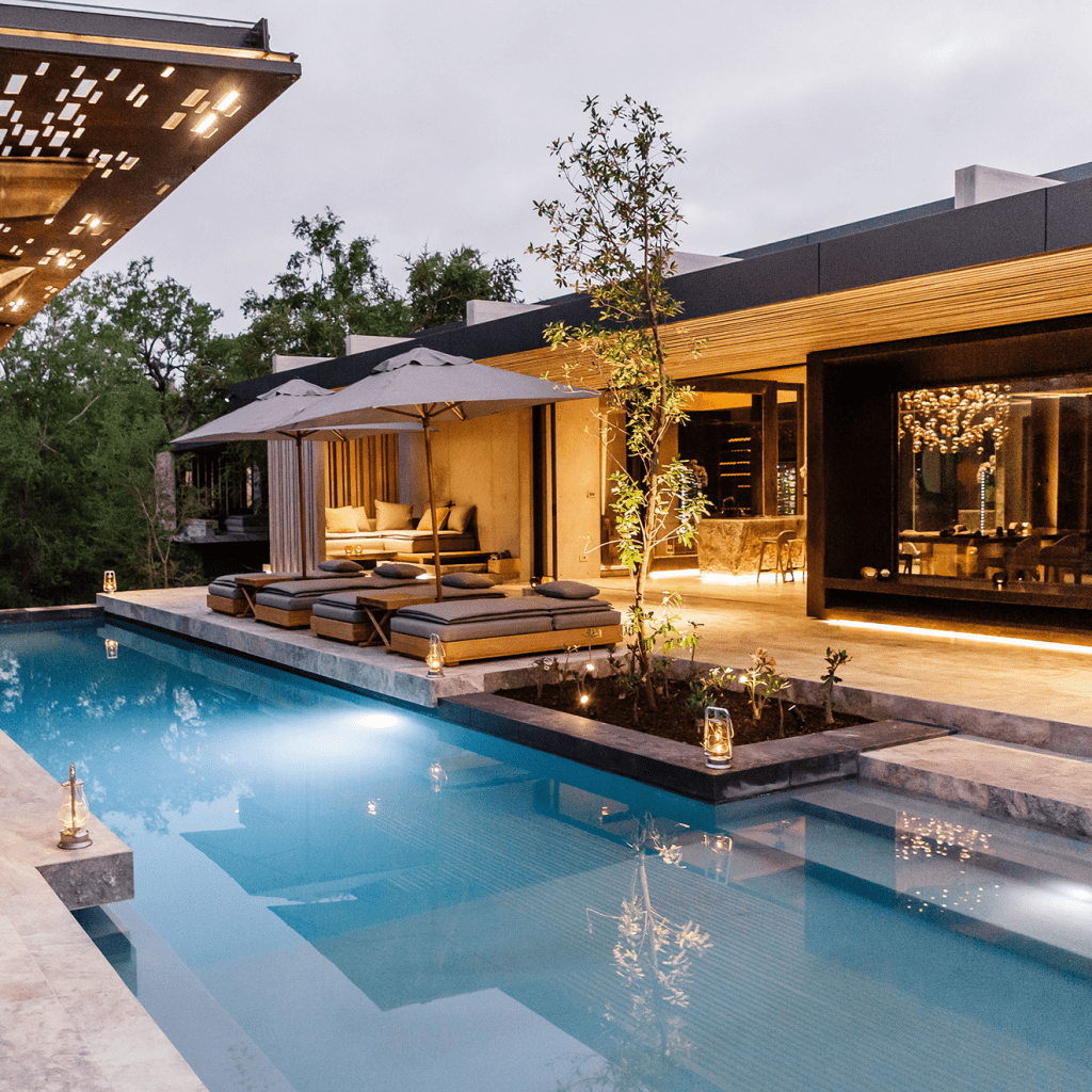 a luxurious outdoor pool an patio at Cheetah Plains