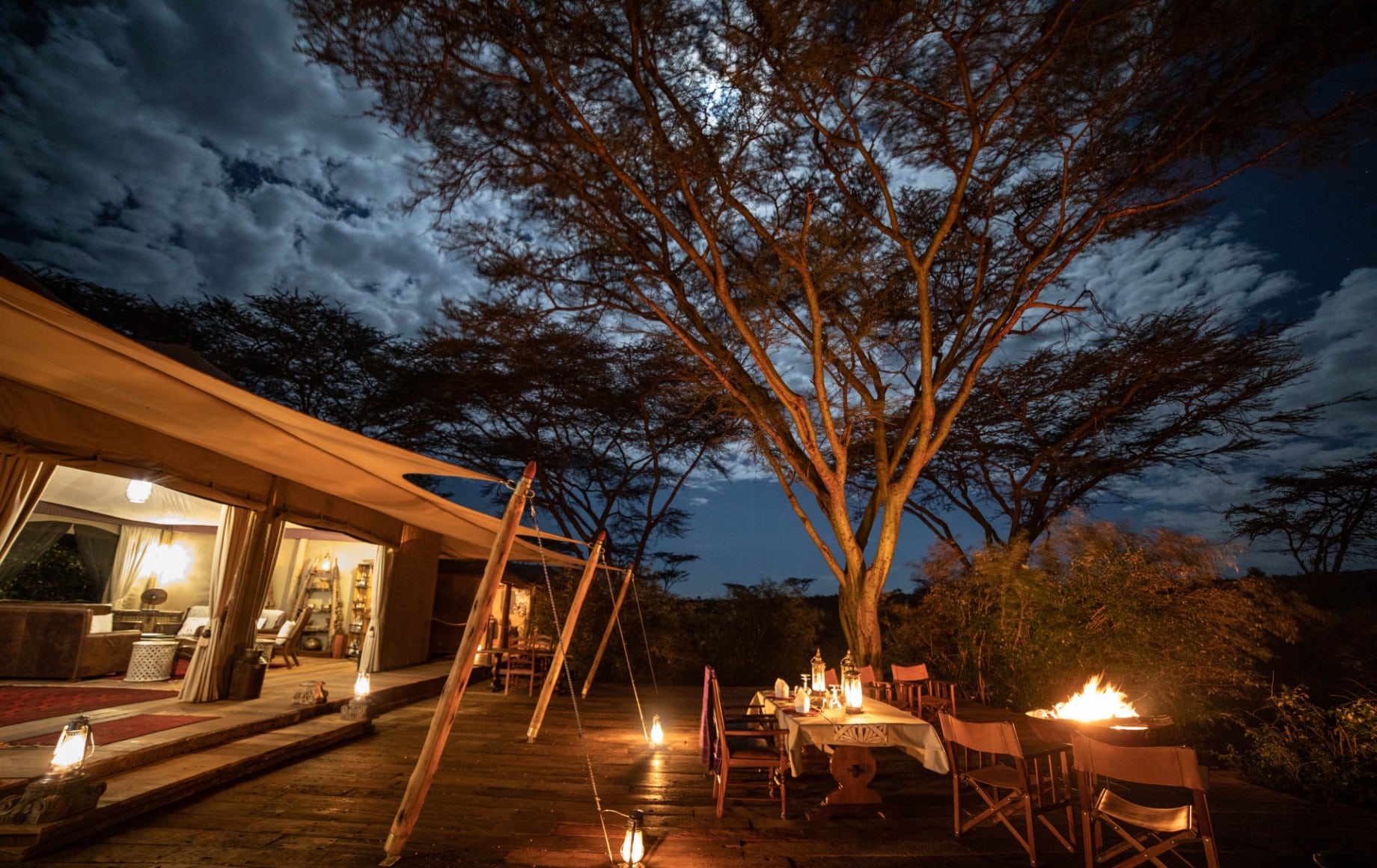 the lawn outside of a room at Mara Nyika at night