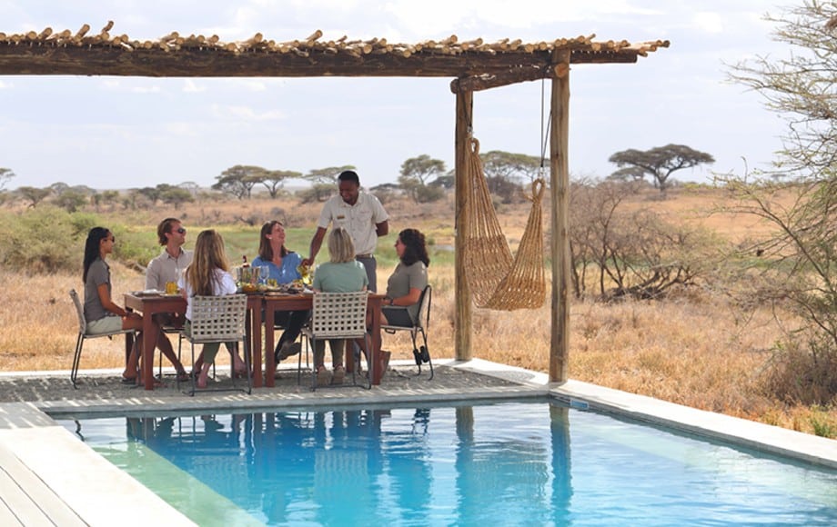 People by the pool at Namiri Plains