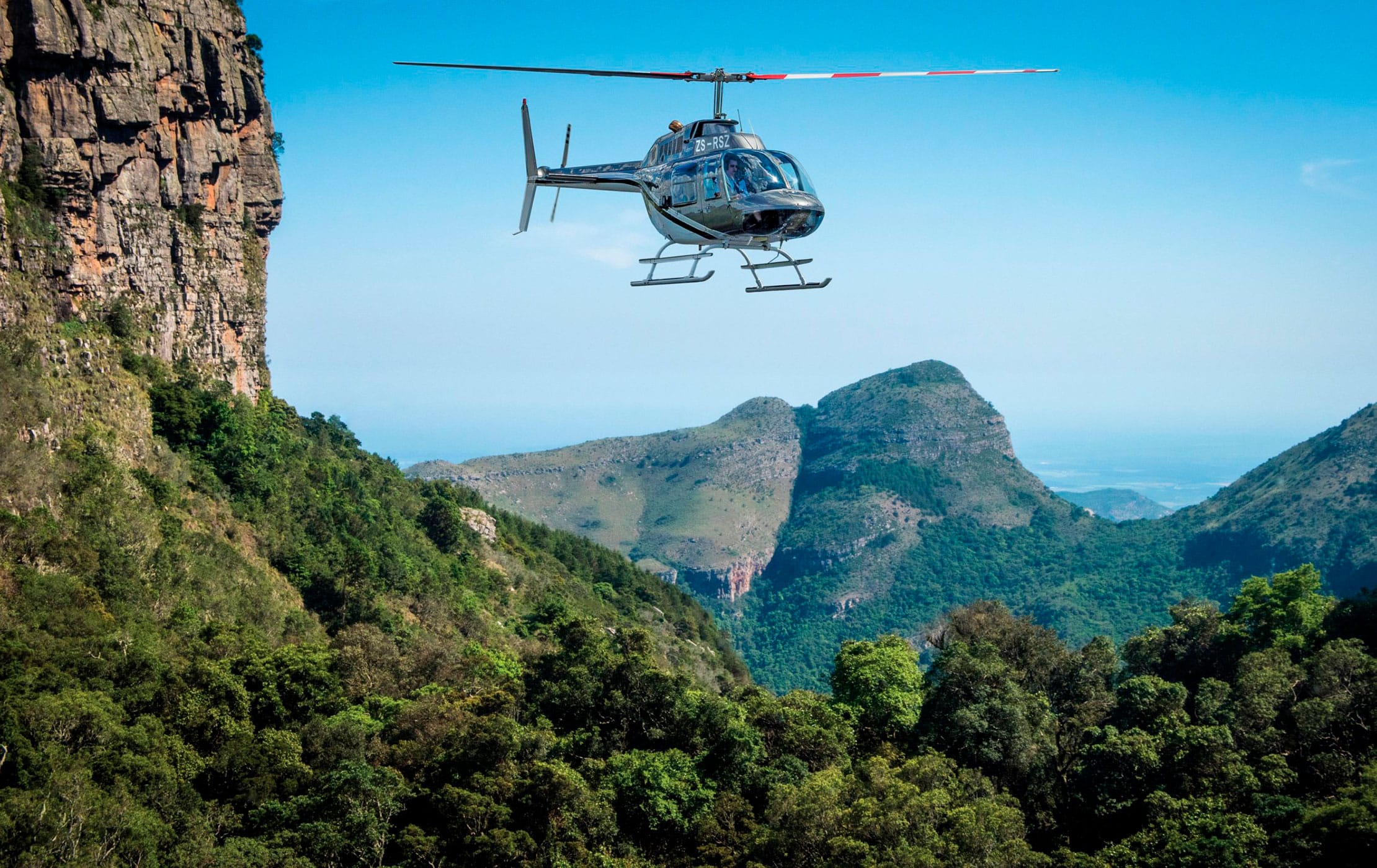 A helicopter flying over South Africa’s Grandest Canyon