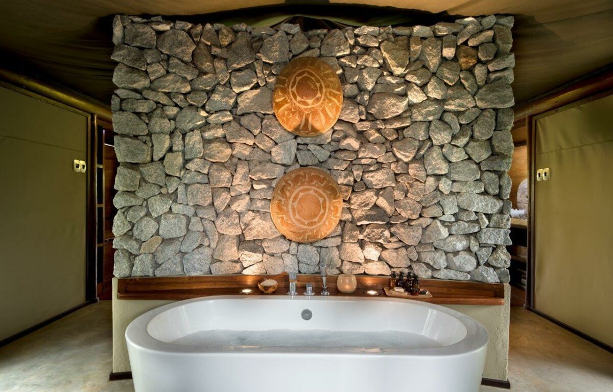 bathtub with rock wall.